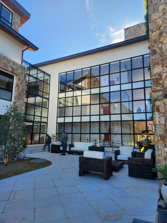 a large building with a lot of windows at Quarto no Wanderlust Experience Hotel in Campos do Jordão