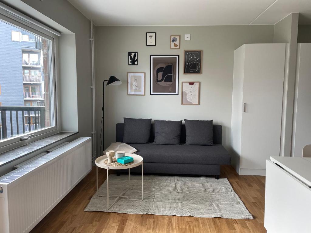 a living room with a couch and a table at Casa Silvborn in Gothenburg