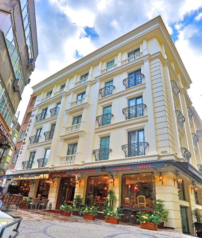 a large white building with plants in front of it at Anthemis Hotel in Istanbul