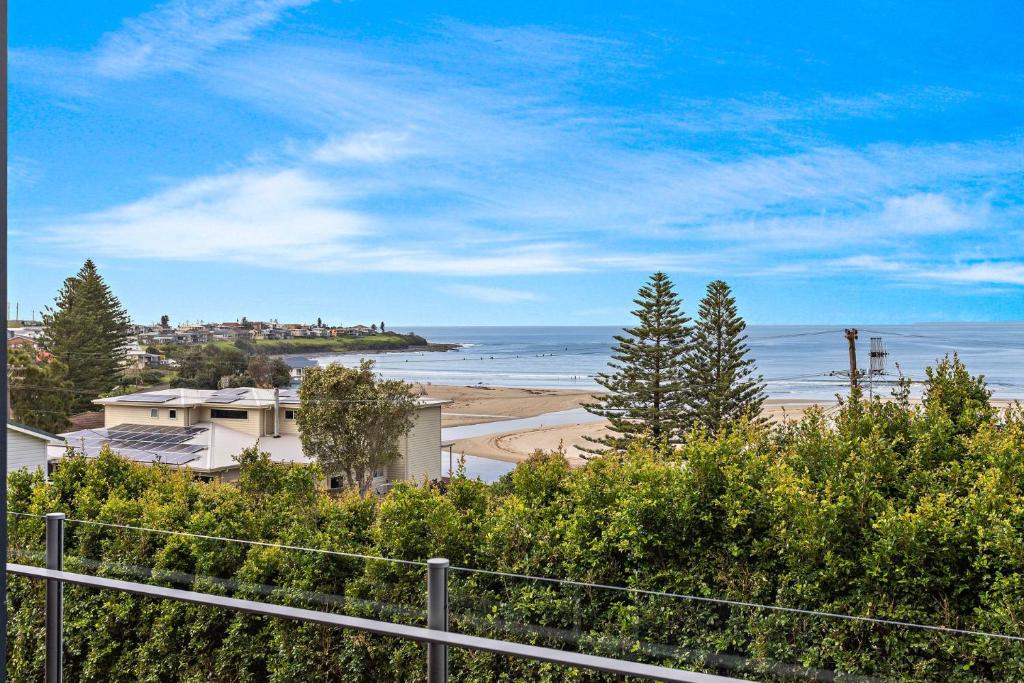 a view of a beach and the ocean at Riverleigh, Gerroa in Gerroa