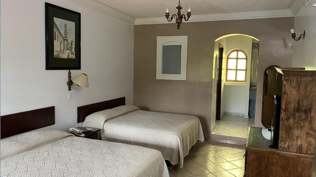 Katil atau katil-katil dalam bilik di Hotel Camelinas