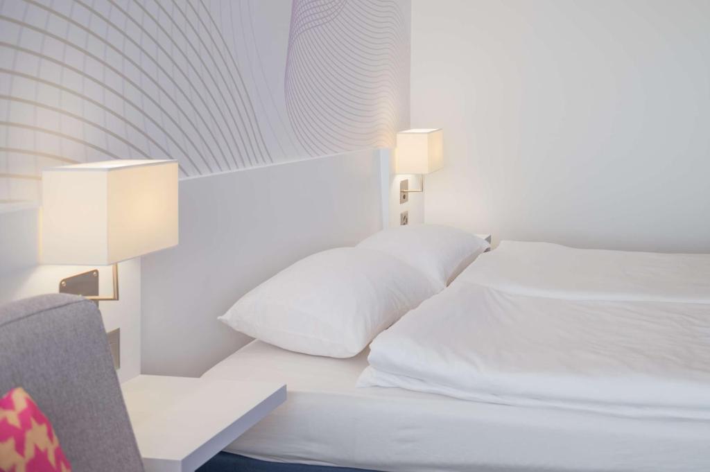 Postel nebo postele na pokoji v ubytování Prize by Radisson, Zurich Affoltern am Albis