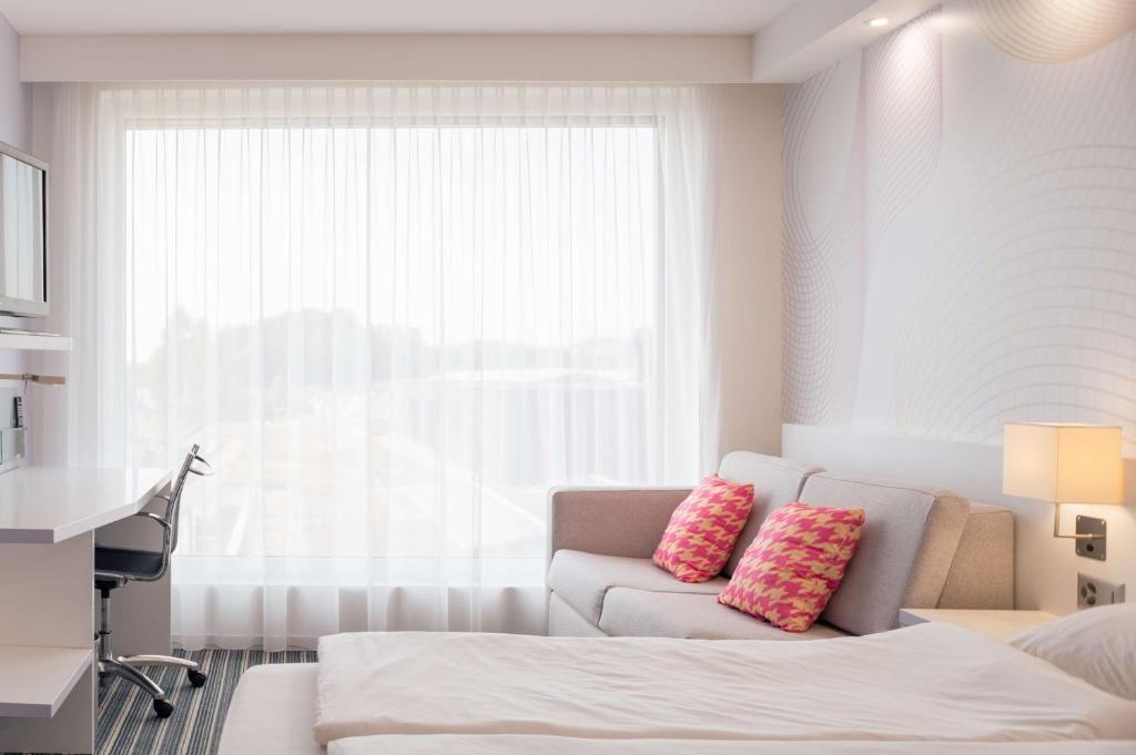 Postel nebo postele na pokoji v ubytování Prize by Radisson, Zurich Affoltern am Albis