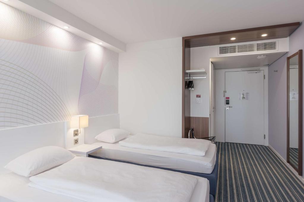 Postel nebo postele na pokoji v ubytování Prize by Radisson, Zurich Affoltern am Albis