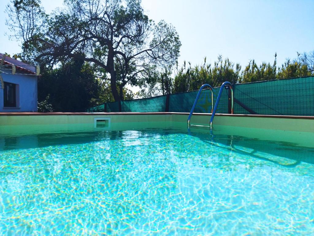 a large swimming pool with a water slide at Casa da Serra in Nazaré