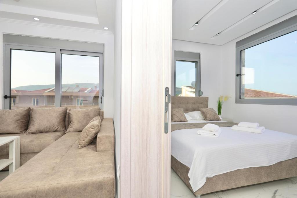 Postel nebo postele na pokoji v ubytování NESI Apartments
