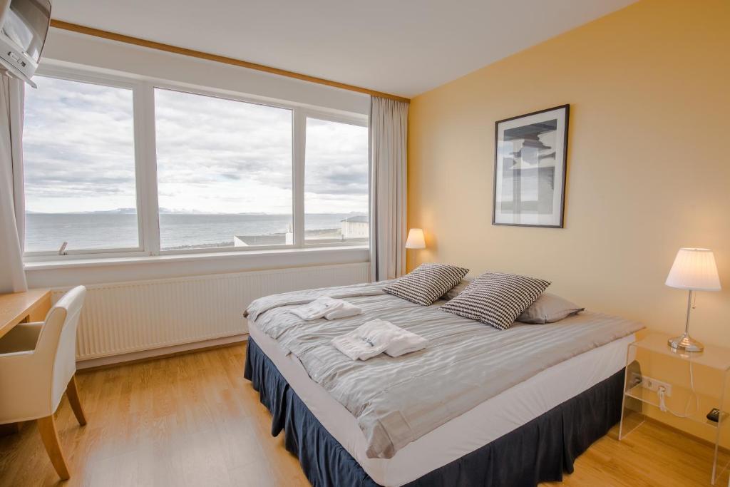 Postel nebo postele na pokoji v ubytování Hotel Keilir by Reykjavik Keflavik Airport