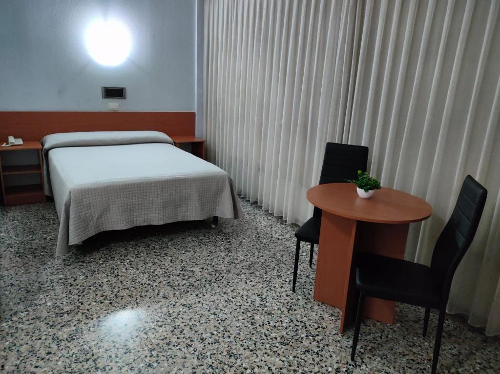 Postel nebo postele na pokoji v ubytování Hotel Cogullada