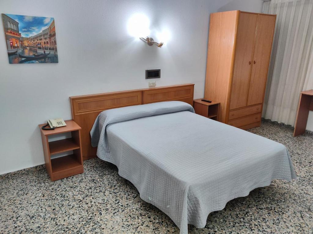 Postel nebo postele na pokoji v ubytování Hotel Cogullada