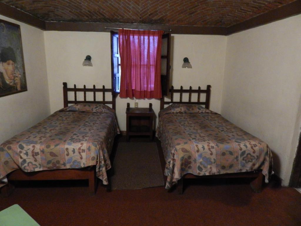 Postel nebo postele na pokoji v ubytování Hotel Molino del Rey