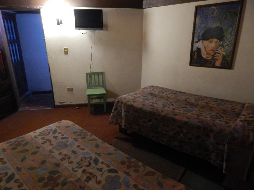 Postel nebo postele na pokoji v ubytování Hotel Molino del Rey