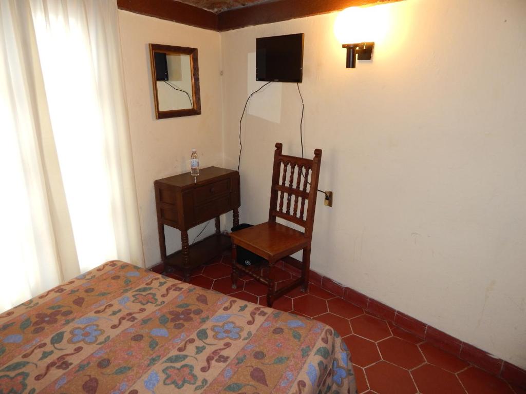 Postel nebo postele na pokoji v ubytování Hotel Molino del Rey