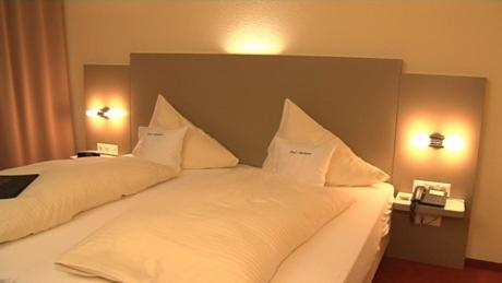 Postel nebo postele na pokoji v ubytování Hotel Graf Balduin