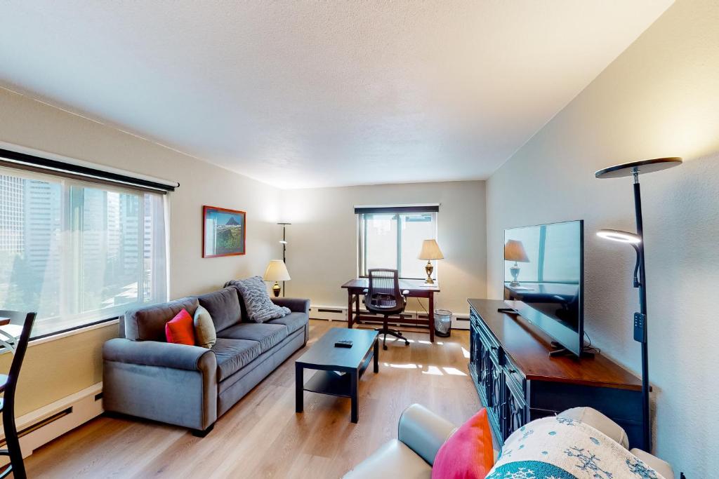 a living room with a couch and a table at Emerald Skyline in Seattle