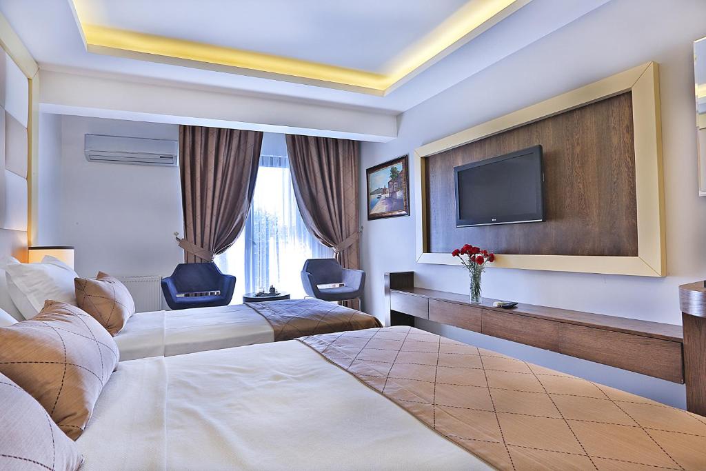 Postel nebo postele na pokoji v ubytování Grand Sagcanlar Hotel