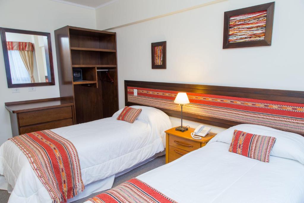 Postel nebo postele na pokoji v ubytování Hotel Cottbus