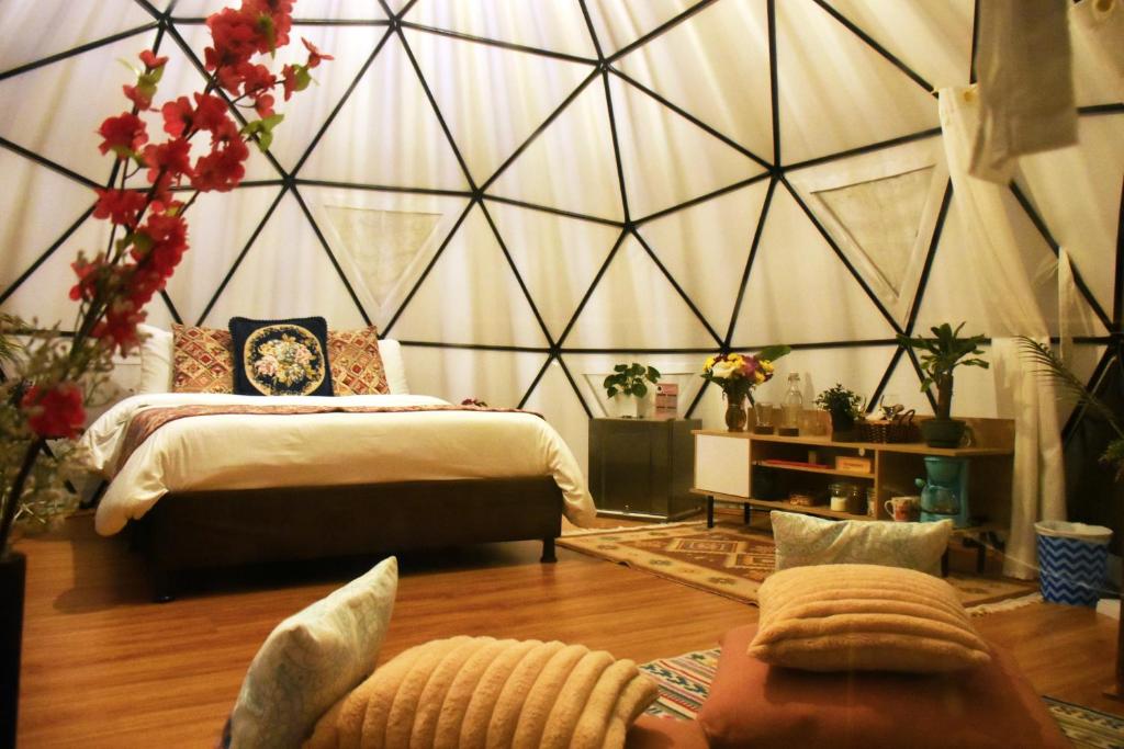 Postel nebo postele na pokoji v ubytování Glamping Claro de Luna