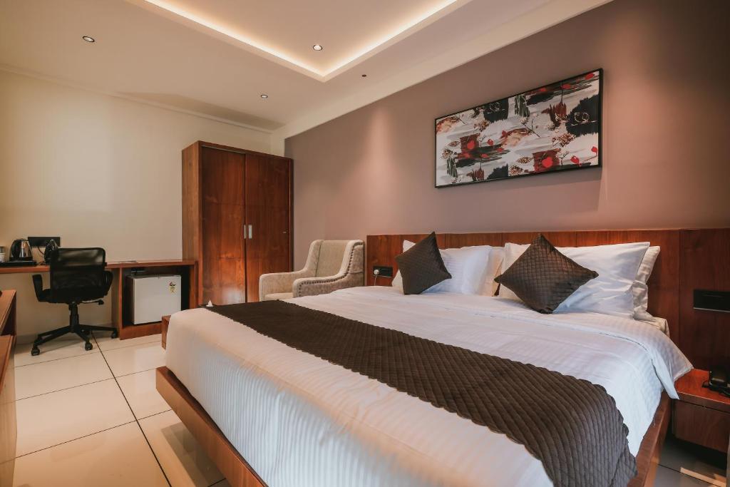 Postel nebo postele na pokoji v ubytování Fortview Suites