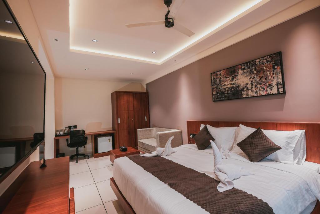 Postel nebo postele na pokoji v ubytování Fortview Suites