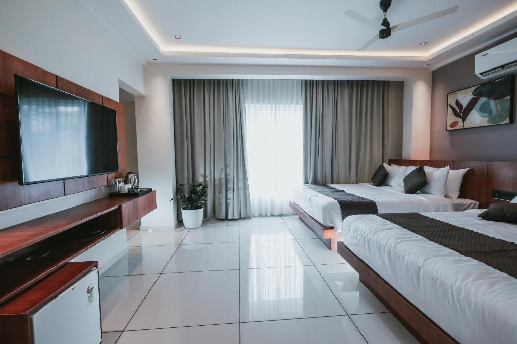 Postel nebo postele na pokoji v ubytování Fortview Suites