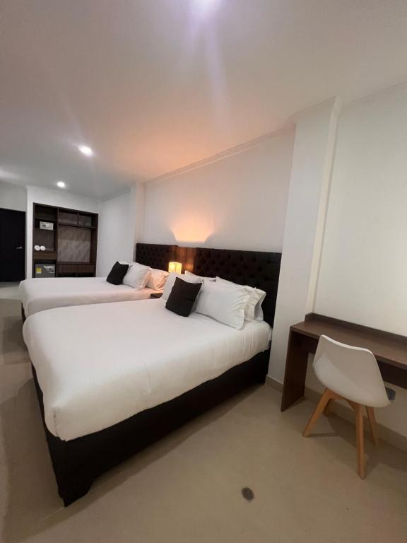 Postel nebo postele na pokoji v ubytování Hotel Zuriel Boutique