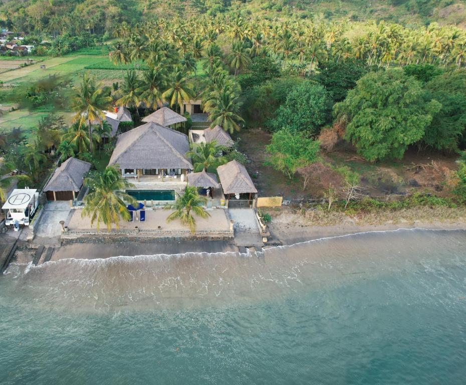 an aerial view of a house on the beach at Seaside Villa Kecil in Sekotong