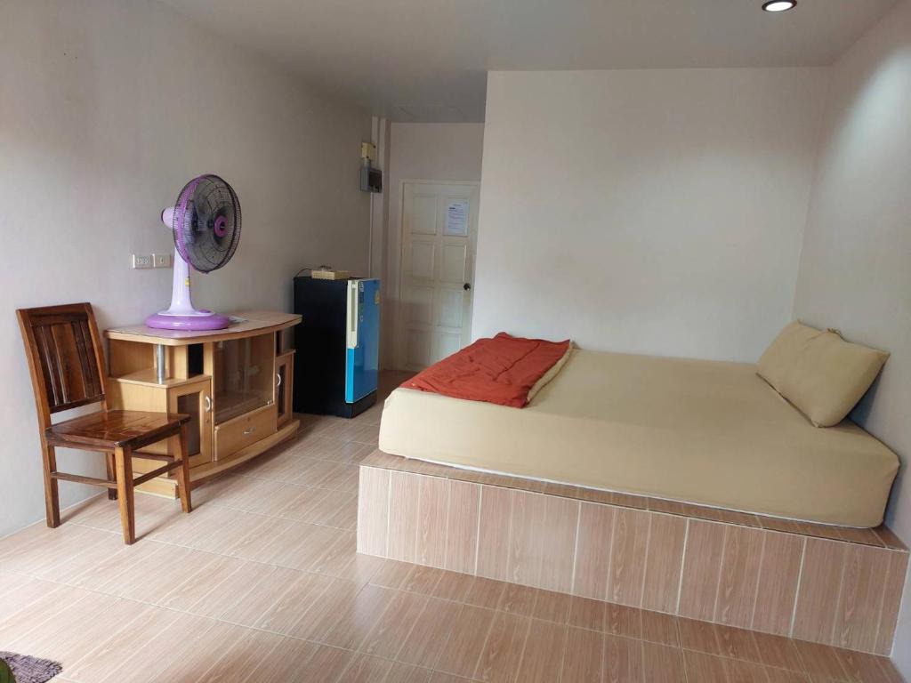 Postel nebo postele na pokoji v ubytování Sairee Center Guest House