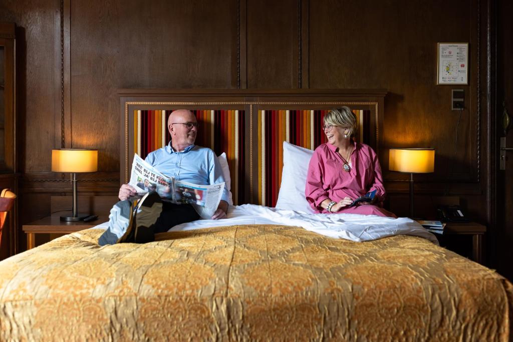 Postel nebo postele na pokoji v ubytování Hotel Aalders
