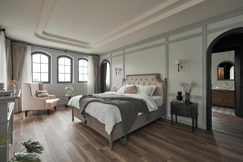 Postel nebo postele na pokoji v ubytování Davilla Đà Lạt Villa Collection