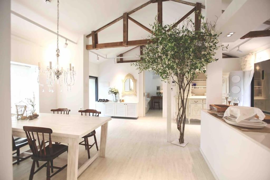 a kitchen and dining room with a table and chairs at Gonae Reborn in Jeju