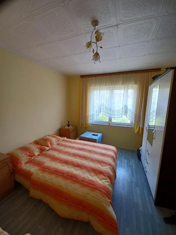 Ένα ή περισσότερα κρεβάτια σε δωμάτιο στο Putnik