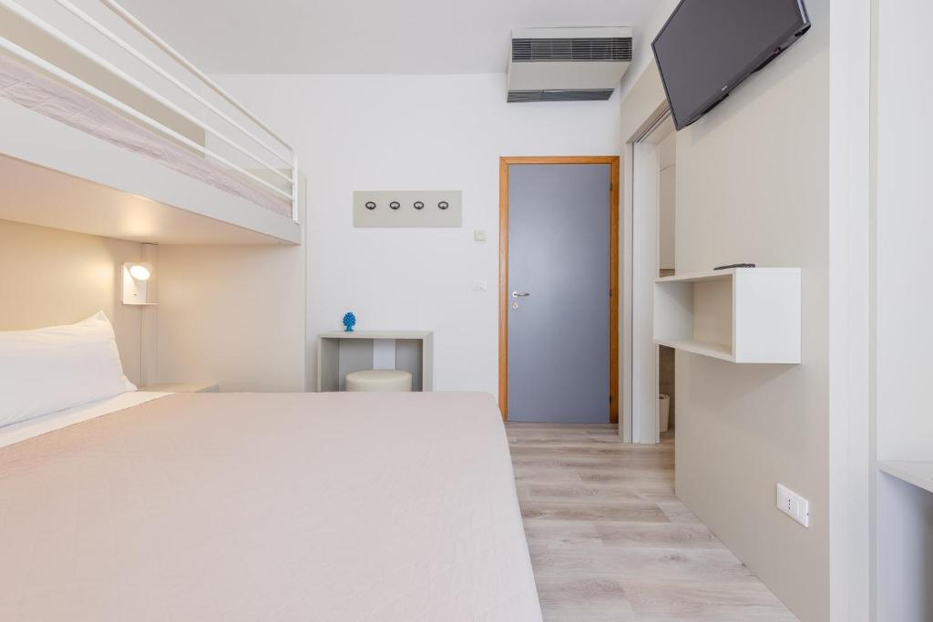 Postel nebo postele na pokoji v ubytování Hotel Madera