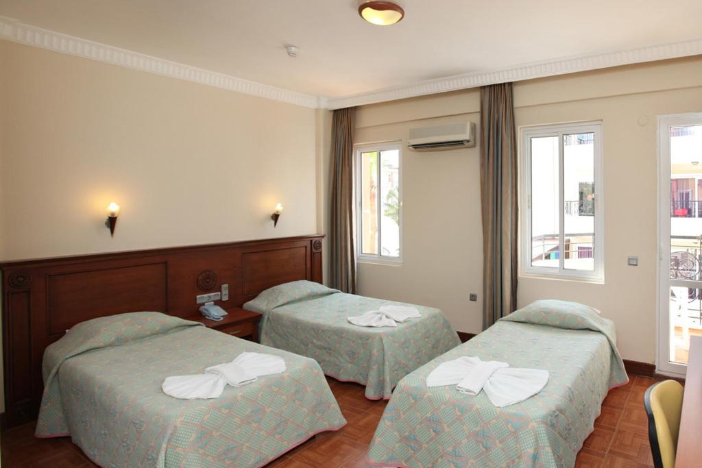 Postel nebo postele na pokoji v ubytování Fidan Apart Hotel