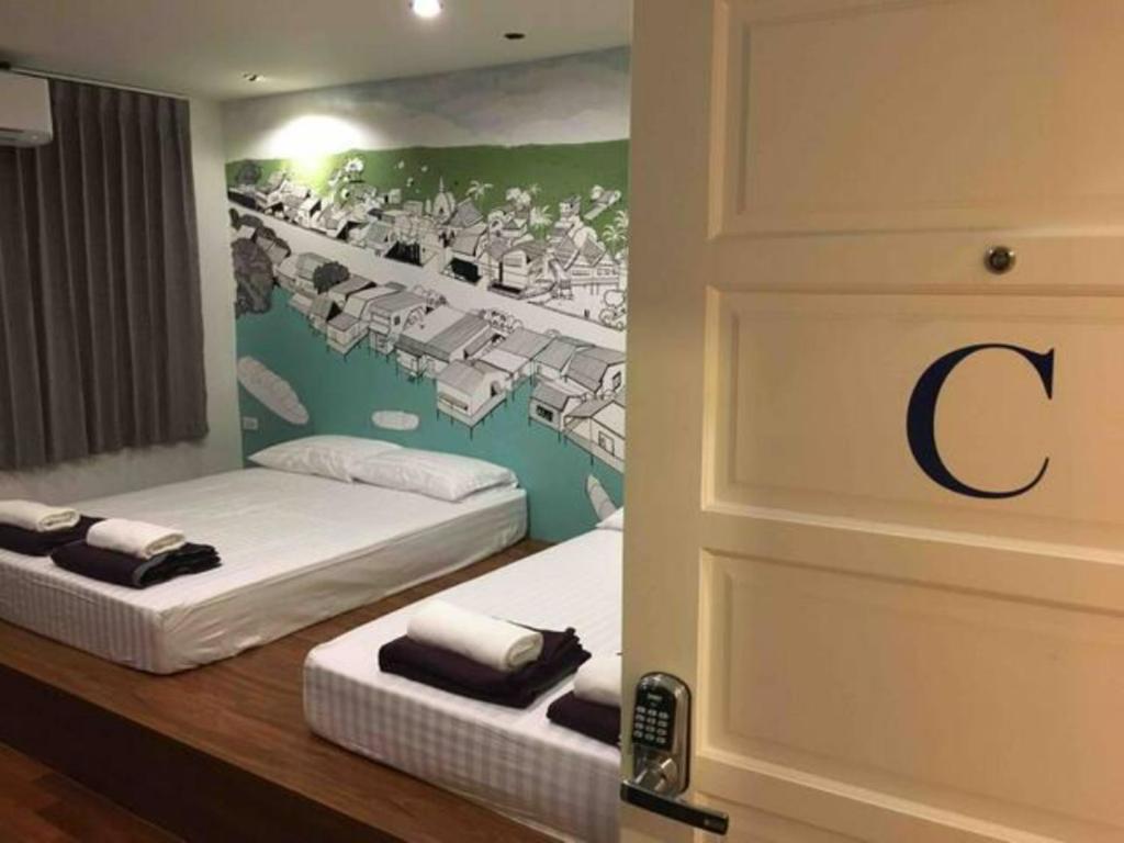 Postel nebo postele na pokoji v ubytování 99 Hostel Khaosan