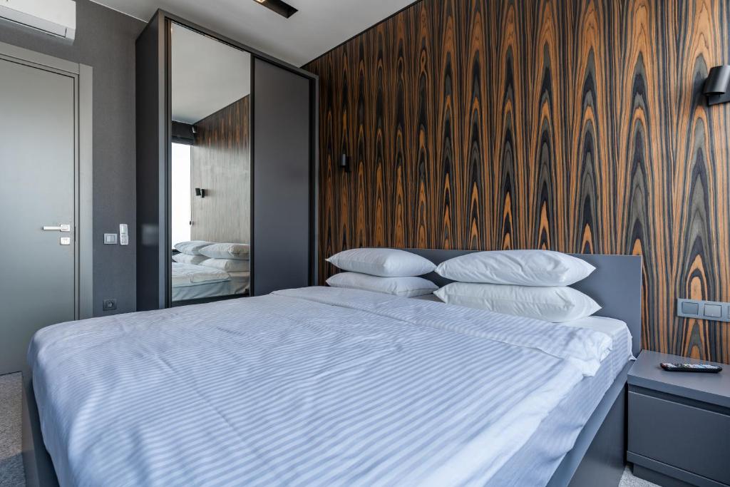 Postel nebo postele na pokoji v ubytování Gumbati Apart Hotel