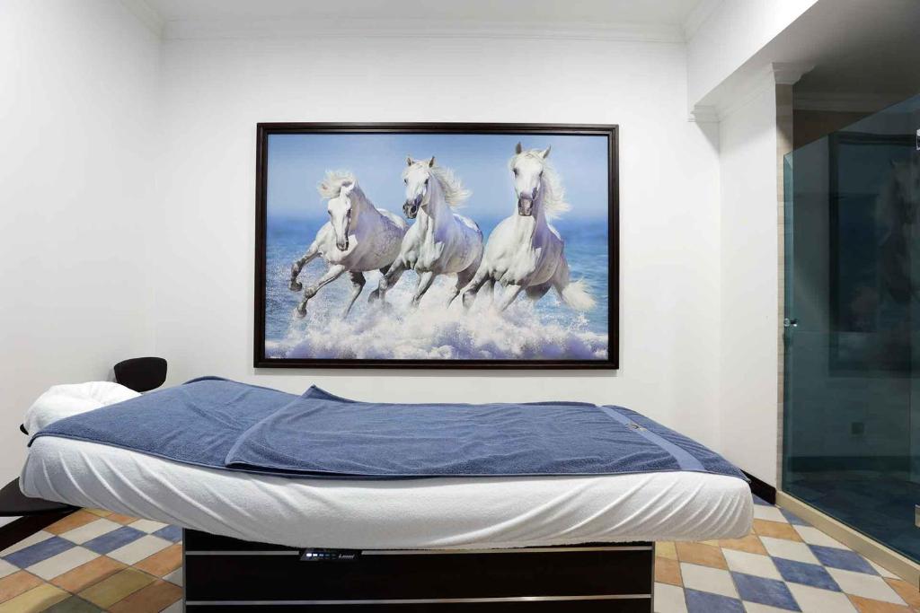 Postel nebo postele na pokoji v ubytování Armaco Residence