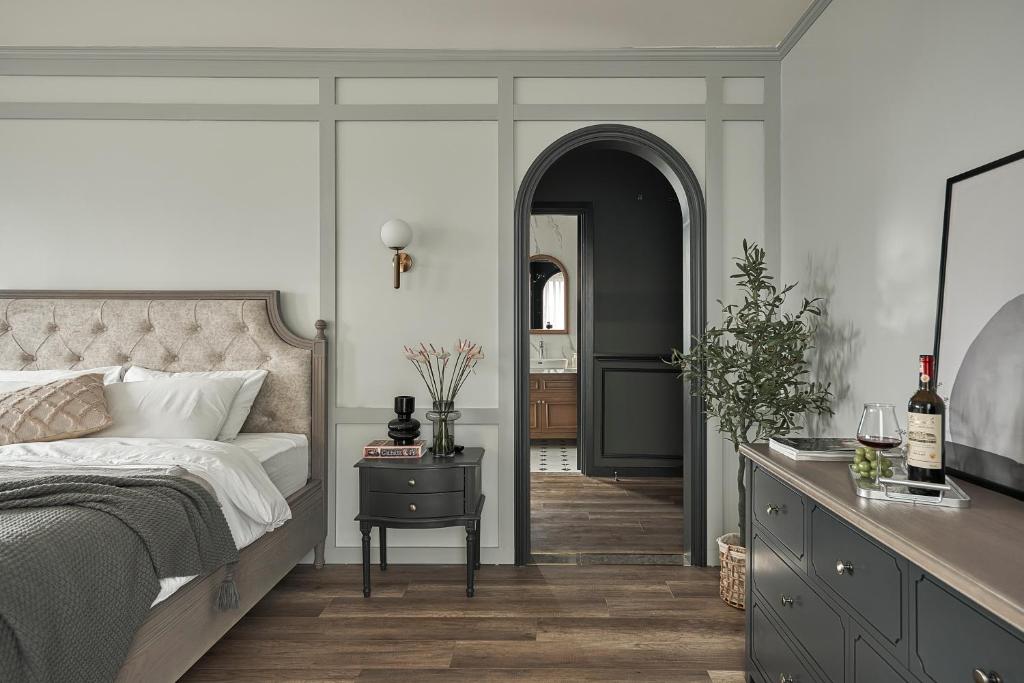 Postel nebo postele na pokoji v ubytování Davilla Đà Lạt Villa Collection