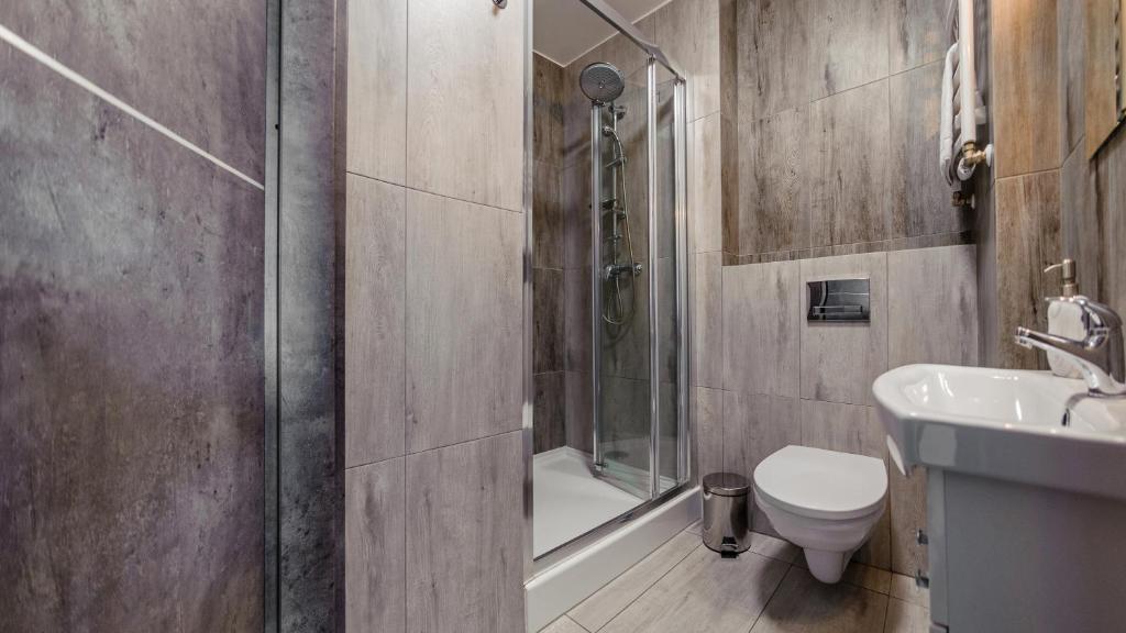 Koupelna v ubytování Apartamenty Sun & Snow Sanatoryjna - blisko plaży