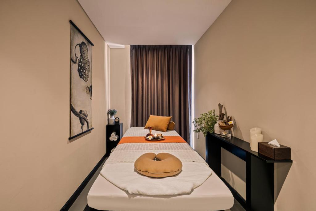 Postel nebo postele na pokoji v ubytování Sanouva Da Nang Hotel - Daily Afternoon Tea Inclusive
