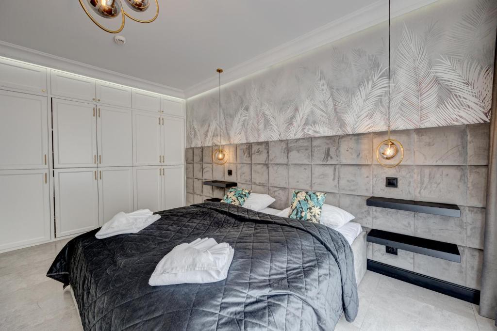 Posteľ alebo postele v izbe v ubytovaní MALAGA APARTAMENTY BALTICUS