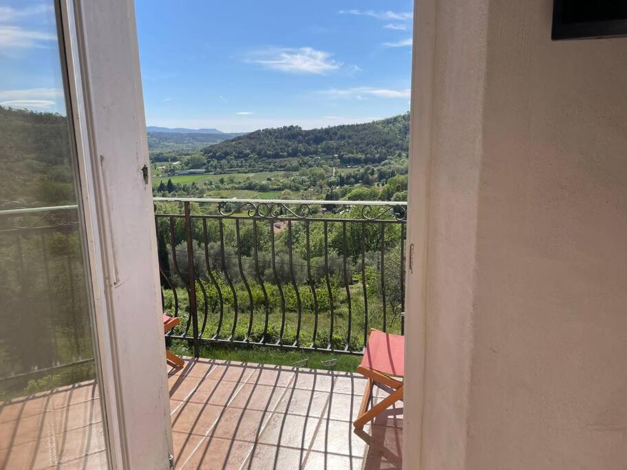 an open door to a balcony with a view at Appartement de type duplex in Callian