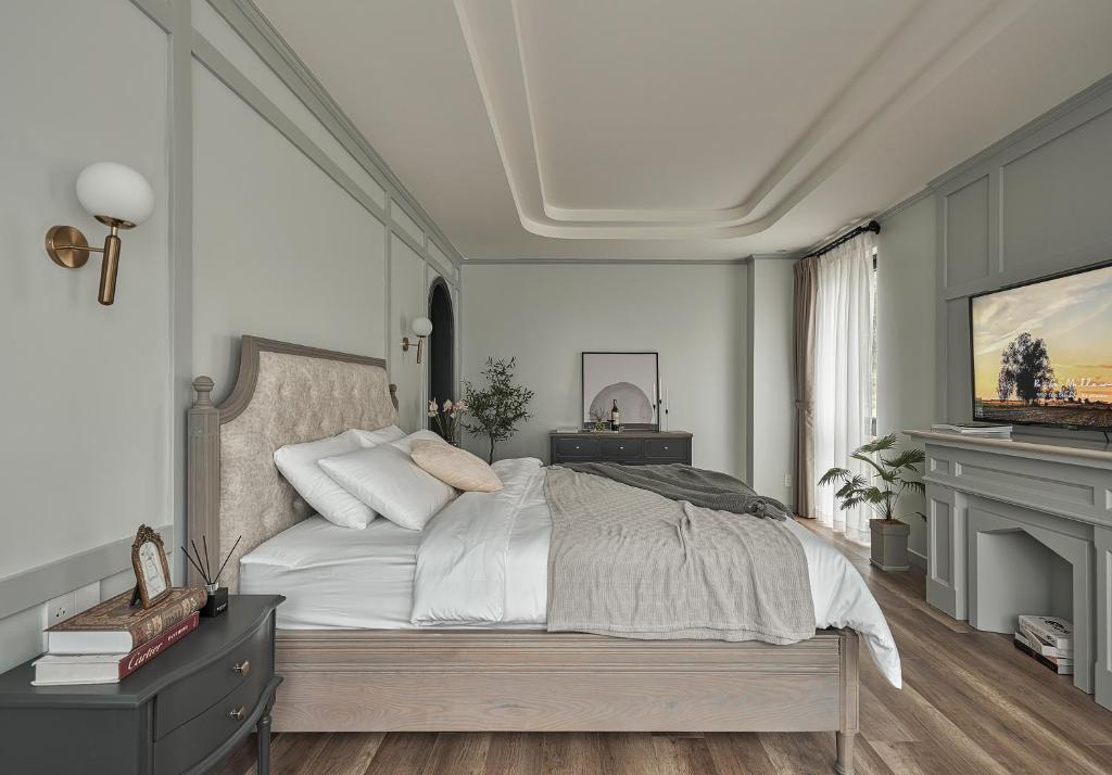 Postel nebo postele na pokoji v ubytování Davilla Đà Lạt Villa Collection