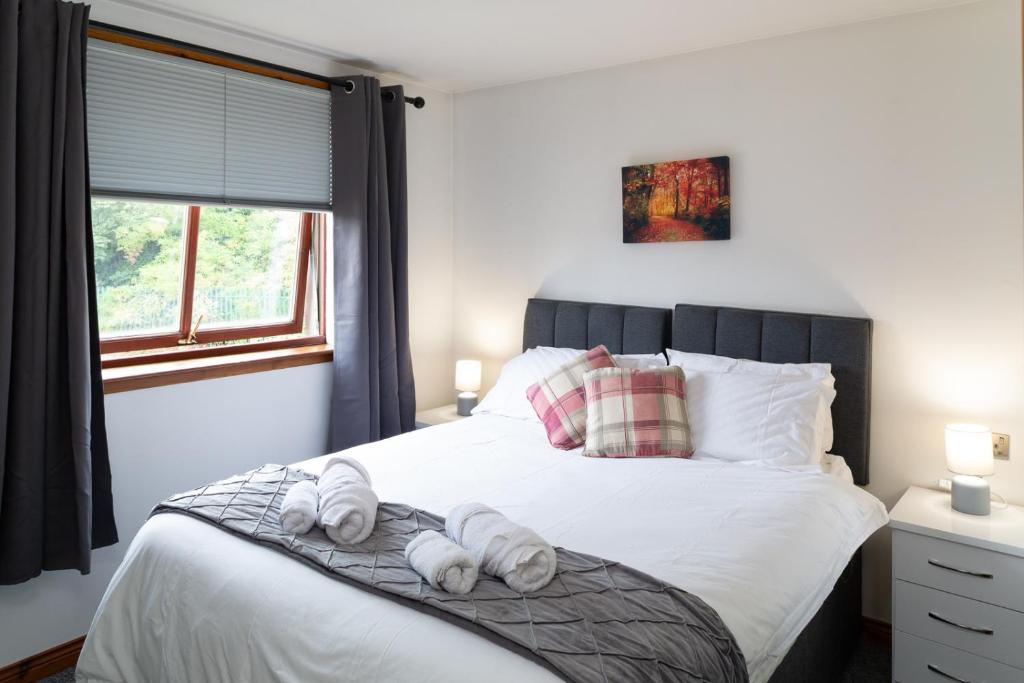 מיטה או מיטות בחדר ב-Bothwell Court Apartments