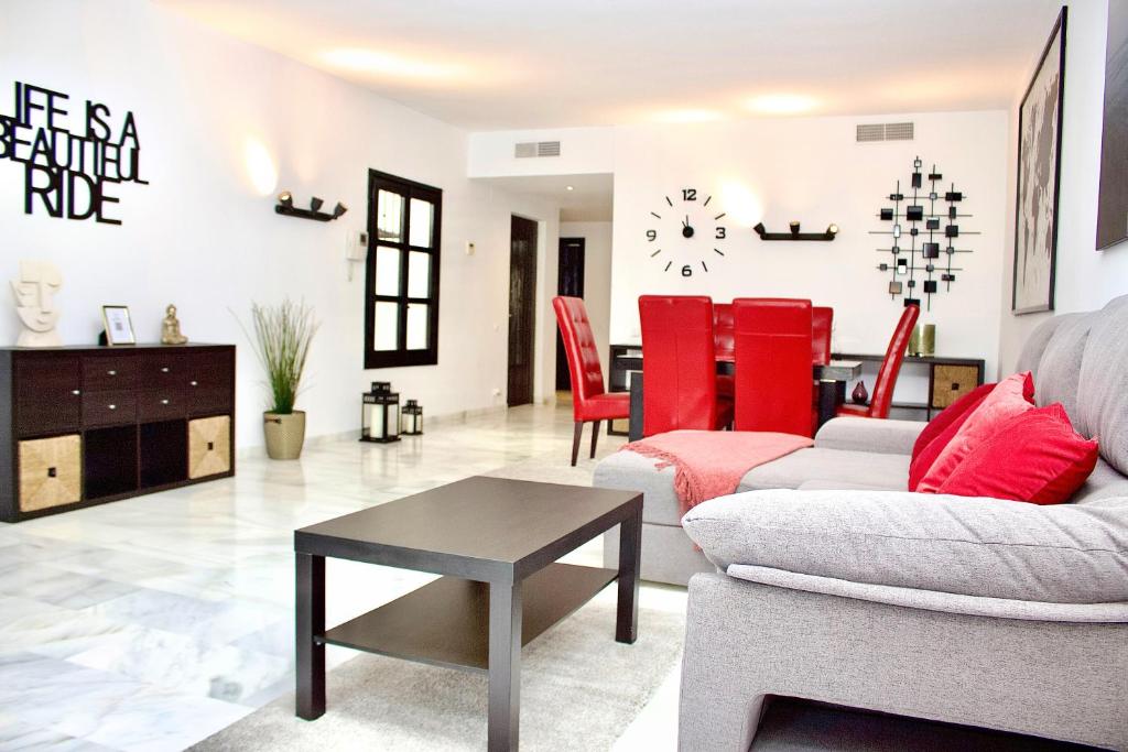 a living room with a couch and a table at Second line Puerto Banús top floor in Marbella