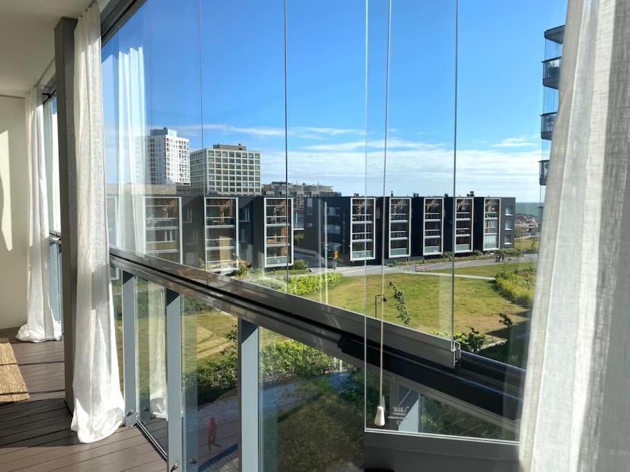a balcony with a view of a city at Tilava yksiö 35,5 m2 merenrannalla in Helsinki