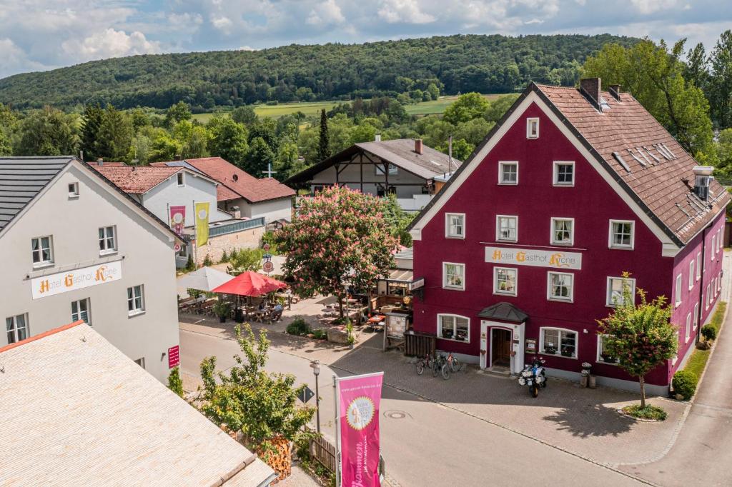 an aerial view of a town with a red building at Gasthof Krone in Kinding