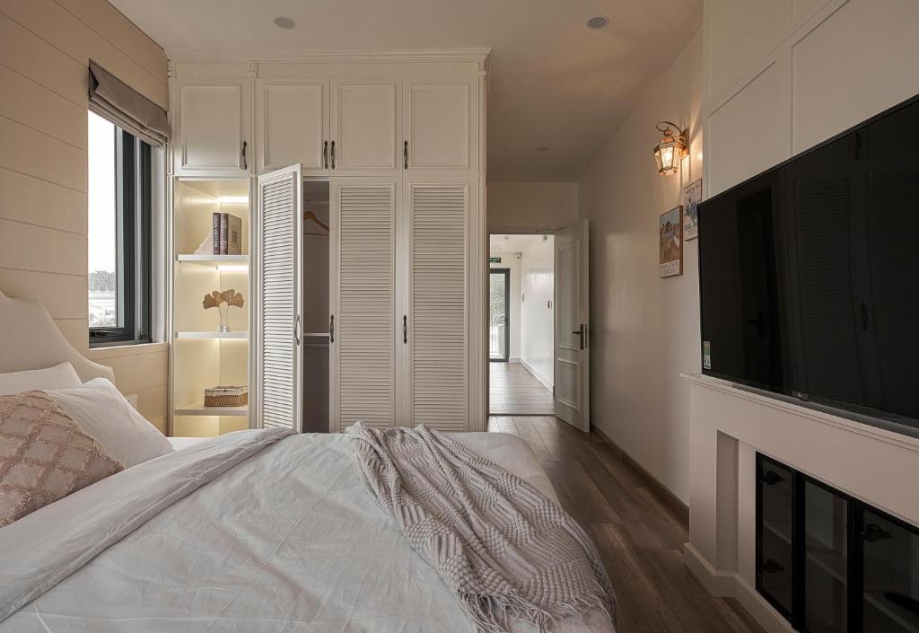 Postel nebo postele na pokoji v ubytování Davilla Đà Lạt Villa Collection