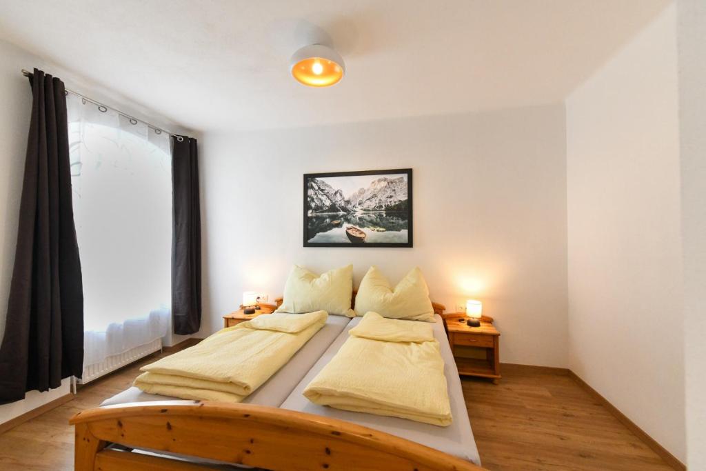 Postel nebo postele na pokoji v ubytování Ferienapartments 31erHaus