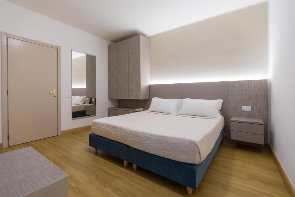 Postel nebo postele na pokoji v ubytování Lu' Hotel Porto Pino