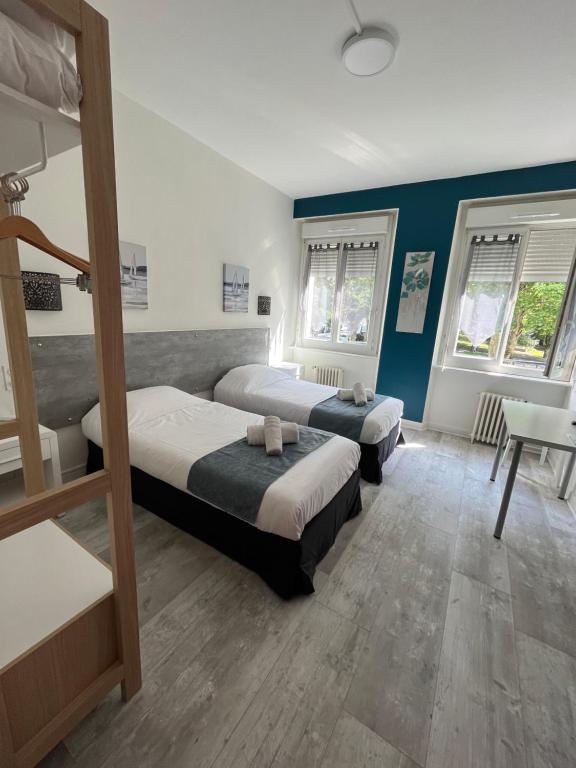 Postel nebo postele na pokoji v ubytování Hôtel Agena